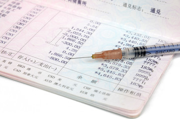 Passbook and syringe