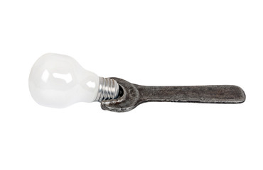 Old rusty wrench and lamp, isolated on a white background