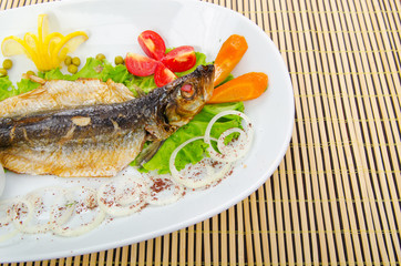 Fried fish in the plate