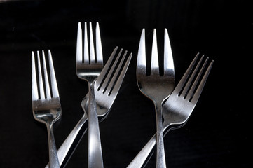 Fork on the black background