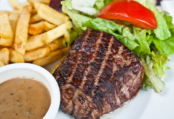 juicy steak beef meat with tomato and french fries