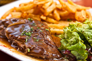 juicy steak beef meat with tomato and french fries