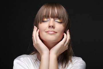 Portrait of a beautiful female on black background