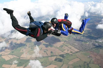 Fotobehang Two skydivers in freefall © Joggie Botma