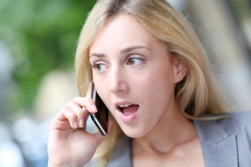 City girl talking on mobile phone in the street