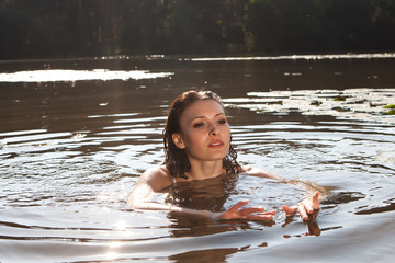 Beautiful young woman  in the river
