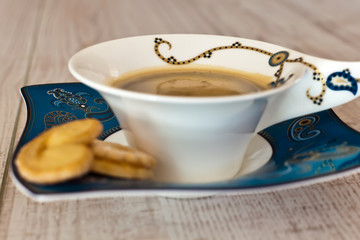 Coffee cup on white wood table
