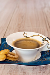 Coffee cup on white wood table