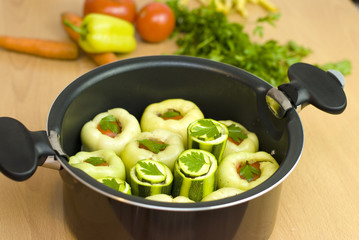 pan with stuffed peppers and zucchini