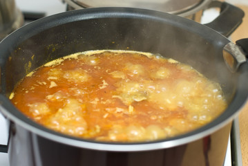 Rice, meat carrots and spices, cooking Uzbek pilaf.