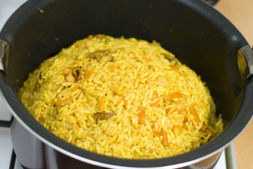 Rice, meat carrots and spices, cooking Uzbek pilaf.