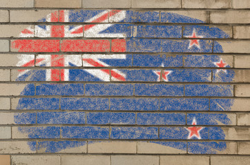 flag of New Zealand on grunge brick wall painted with chalk