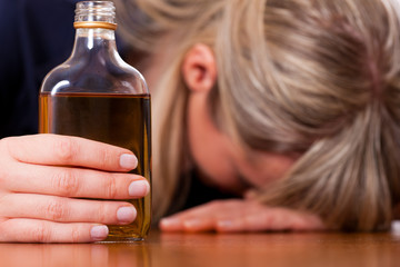 Alcohol abuse - woman drinking too much brandy
