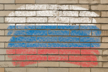 flag of Russia on grunge brick wall painted with chalk
