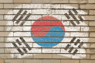 flag of South Korea on grunge brick wall painted with chalk