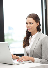 happy woman with laptop computer