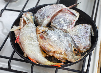 Fried fish in a frying pan