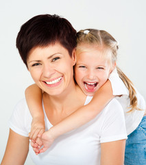 Mother and daughter laughing