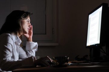 Business person working overtime with neck pain