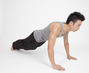 Chinese man doing push ups