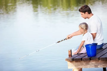 Zelfklevend Fotobehang Father and daughter go fishing © AboutLife