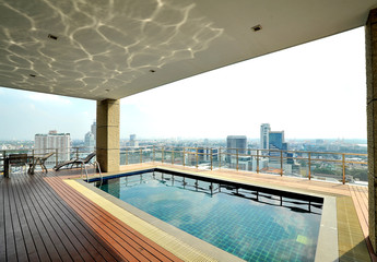 City view and reflection on the roof top pool
