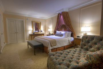 Bedroom with lamps canopy king-size bed