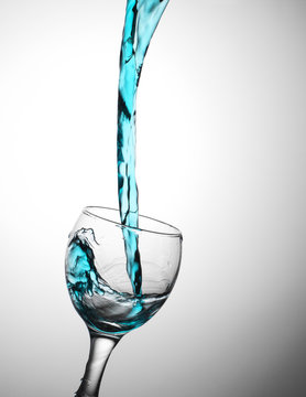 blue water flow in a glas