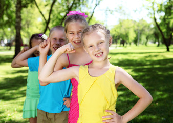 Fototapeta premium Children playing in the summer park