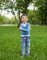 Fototapeta premium Portrait of a little boy outdoors