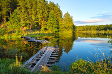 Colorful landscape with a wooden bridge over the river