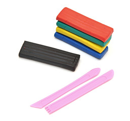 Fototapeta premium Color children's plasticine lies on a white background