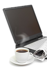 Fototapeta na wymiar A cup of coffee on a laptop