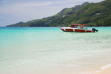 Seascape with a red  fisherman's boat