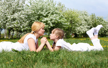 girl with mother in spring park