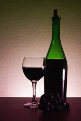 Grapes, red wine bottle, glass.