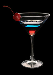 Tri-color cocktail martini with a cherry