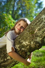 girl lying on a tree