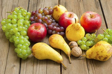 apples grapes and pears, wooden table