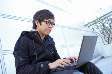man using computer outdoor