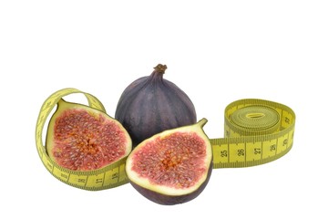 Figs with measuring tape as healthy eating concept