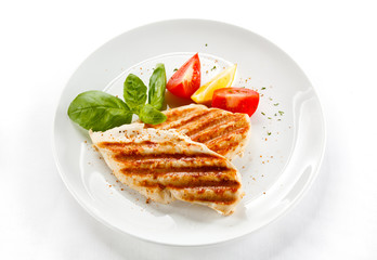 Grilled chicken breasts and vegetables