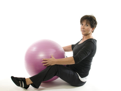 senior woman fitness exercise with core training ball