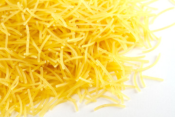 dried italian pasta on white background