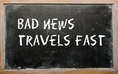 "Bad news travels fast" written on a blackboard