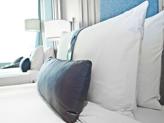 a pillows on beds in a luxury hotel room