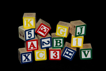 Pile of Alphabet Blocks over Black