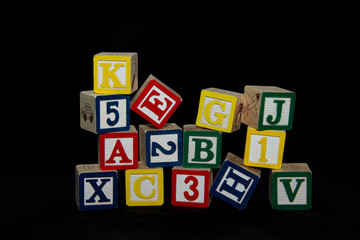 Pile of Alphabet Blocks over Black
