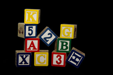 Crumbling Pile of Blocks over Black