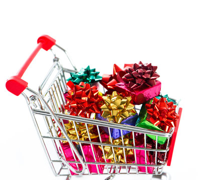 Shopping cart with colorful christmas gift boxes